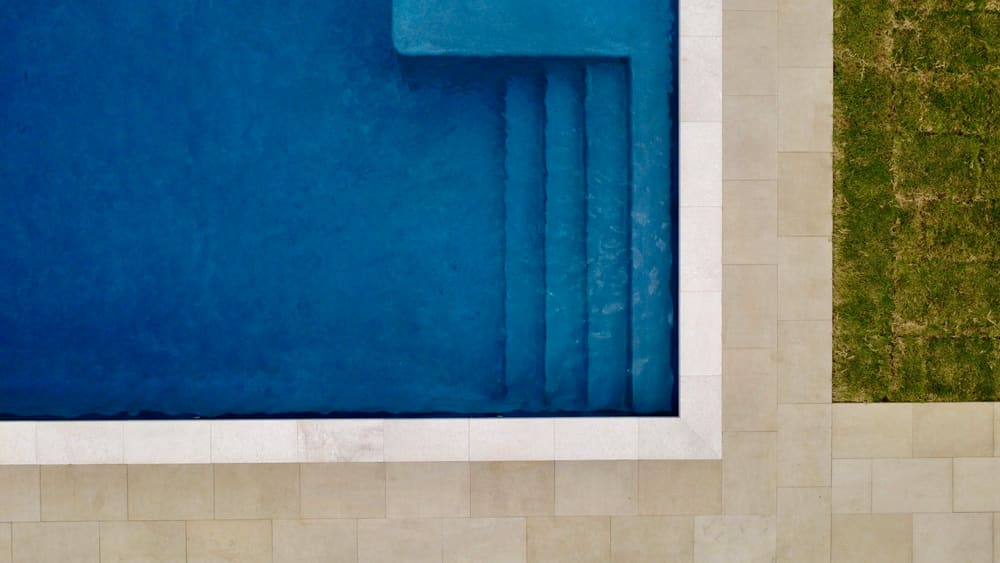 Aerial view of custom pool steps and deck — Southlake, TX